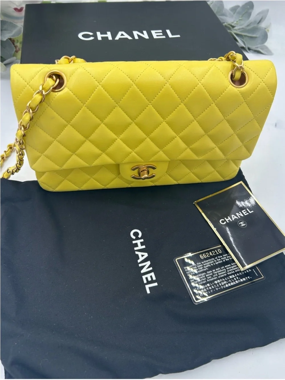 CHANEL CLASSIC QUILTED double flap bag . Yellow with gold hardware .